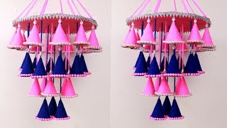 How to make woolen jhumar  Wool Chandelier  Wool Wind Chime  Best out of waste Biscuit packet [upl. by Cyrill795]