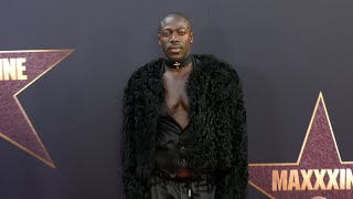 Moses Sumney attends the red carpet world premiere of quotMaXXXinequot in Los Angeles [upl. by Ymia]