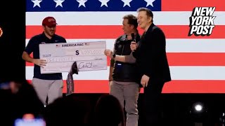 Elon Musk awards random petition signer 1M check vows to do so every day until election [upl. by Ijuy]