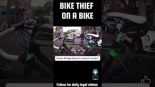 Bike thief tries to steal bike while moving in traffic London [upl. by Leverett]