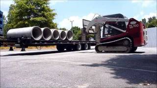 Takeuchi TL150 Unloading Concrete Pipe [upl. by Aneed]