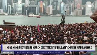 Hong Kong protesters march on station to educate Chinese mainlanders [upl. by Brosine]