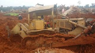 Cat D7 diging out of mud another Cat D7 [upl. by Cyprian335]