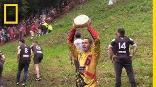 Watch a Downhill CheeseChasing Competition in Britain  National Geographic [upl. by Ntisuj]