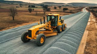 The technique of rural road construction process with a heavy motor grader pushing gravel road base [upl. by Analaj767]