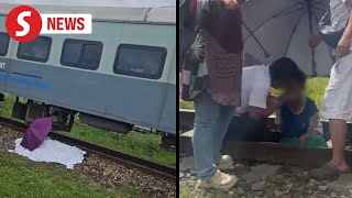 Woman killed son seriously hurt after being hit by train in Sabah [upl. by Kcirded693]