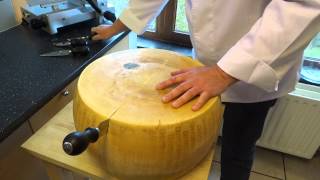 opening a wheel of parmesan cheese parmigiano reggiano [upl. by Kella]