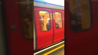 London Underground district line train arriving At Earls Court station [upl. by Rehpotsrihc]