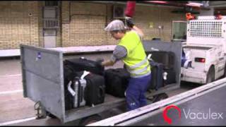 Unloadingloading Baggage between Open Carts and Conveyors  using Vaculex TP BaggageLift [upl. by Auot635]