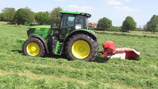 John Deere 6145R Tractor with KUHN FC 284D Mowing [upl. by Ahsaek824]