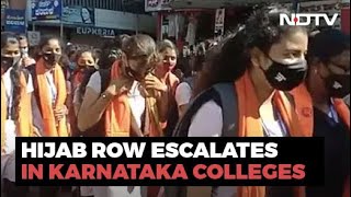 Students Turn Up In Saffron Scarves Amid Row Over Hijab In Karnataka [upl. by Sungam]