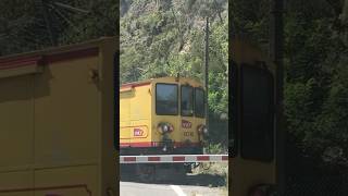 Petit Train Jaune Ligne de Cerdagne crossing N116 road in VillefranchedeConflent France [upl. by Richmal]