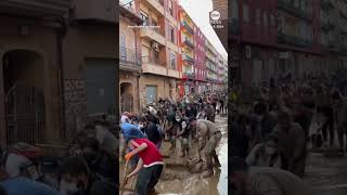 Volunteers sweep water after deadly Spain floods [upl. by Giarg]