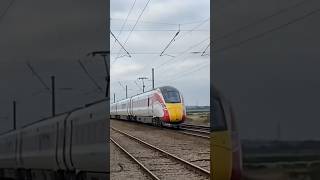 Train at BARNBY LEVEL CROSSING CLAYPOLE 11124 HarrogateKings cross AZUMA [upl. by Kezer]