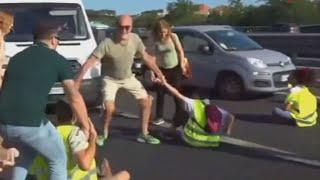 Furious drivers physically drag activists off a busy highway [upl. by Austreng]