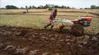 Power tiller operation by plough and ratavator at irrigation farm [upl. by Oivalf]