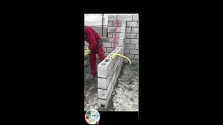 African man laying concrete block [upl. by Gebhardt]