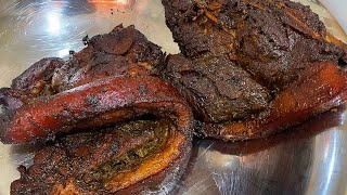 Authentic Jamaican Jerk Pork slowly cook over pimento wood [upl. by Aldrich]