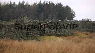 Royal Artillery gunners fire their 105mm light guns durin [upl. by Deva]