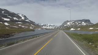 The snowcovered mountaintops along the Hardangerfjord Norway [upl. by Tikna]