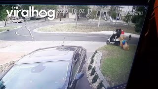 Moped Riders Steal Christmas Decorations  ViralHog [upl. by Llerdna]