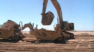 Cat 385C loading Deere 9630 and KTEC scrapers [upl. by Ashwin]