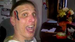 Man Tattoos Romney Logo on Face [upl. by Rimidalv]