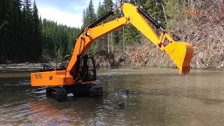 RC ADVENTURES  Piling Rocks in a River with a 4200xl Hydraulic Excavator 112 scale [upl. by Novi]