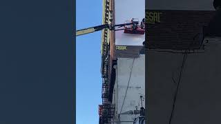 First brushstrokes on a mural with Cadillac repair job at great jones street and bowery nyc [upl. by Ginsberg17]