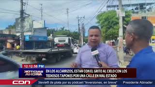 En Los Alcarrizos están con el grito al cielo con los tediosos tapones por una calle en mal estado [upl. by Kehoe707]