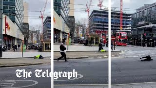 Pedestrians blown over by strong winds as Storm Eunice batters Britain [upl. by Assille]