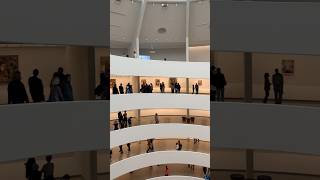 Stunning spiral view of the Guggenheim Museum interior with visitors exploring each level in awe [upl. by Ahseek]