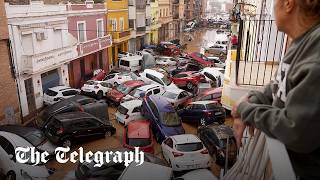 Spain flash floods Dozens dead as cars pile up in Valencia [upl. by Nhguavad935]