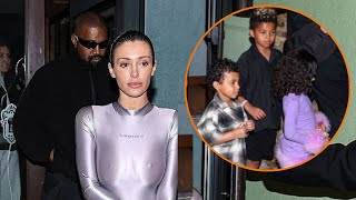 Bianca Censori COVERS UP in a figurehugging shiny jumpsuit for Night out with Kanye West and kids [upl. by Airahs]