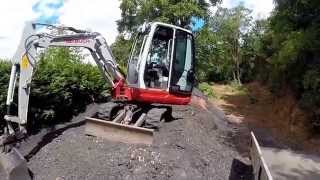 Takeuchi TB228 Mini Digger Loading A Tipper Trailer [upl. by Uaerraj]