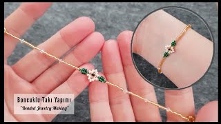 Çiçekli zarif bileklik yapımı Flower elegant thin bracelet making Beaded jewelry tutorial DIY [upl. by Akeihsat723]