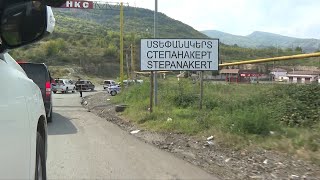 Journalists enter Stepanakert in NagornoKarabakh with Azerbaijani officials  AFP [upl. by Ahsiuqal873]