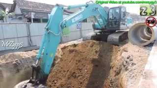 Excavator Kobelco SK200 Digging Loading Pushing Dump Truck [upl. by Devonne]