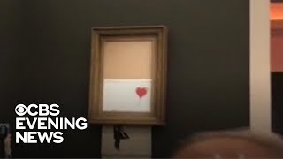 Banksy painting selfdestructs [upl. by Niveek147]