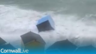 Beach huts washed into the sea as storm batters Cornwall [upl. by Lyrej]