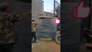 The process of compressing steel wire with the cement board on a forklift [upl. by Ailina]