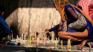 People light candles at Rakab Ganj Gurudwara Delhi [upl. by Setarcos]