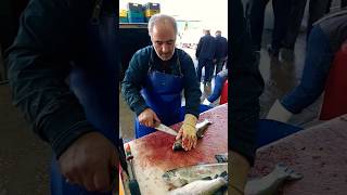 Cleaning farmed trout at a fishmongers with great skill [upl. by Deni]