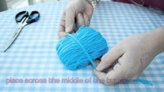 Womans Weekly  How to make a pompom [upl. by Ardnoet540]