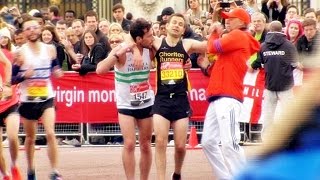 London Marathon runner helps struggling rival to finish [upl. by Ahsirahc705]