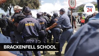 WATCH  Fists fly outside Brackenfell High School as tensions spike between locals and the EFF [upl. by Demitria416]