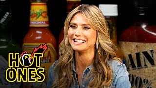 Heidi Klum Strikes a Pose While Eating Spicy Wings  Hot Ones [upl. by Yellah]