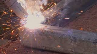 DIY welder welding steel frame on the ground with FCAWS flux core arc welding selfshielded [upl. by Elehcar916]