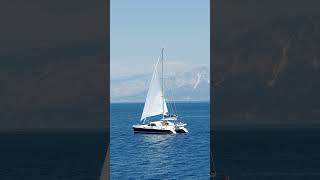 catamaranyachtsailinginopenblueseacoastline automobile [upl. by Dorin58]