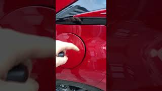 Mazda2 Hybrid 2023 fuel door  how to open it [upl. by Oinolopa964]